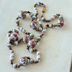 Vintage Venetian Murano glass long necklace with white Fiorato wedding cake beads and copper foil swirl cylinders. Hand‑knotted, 1950s craftsmanship, exquisite detail, and timeless Venetian artistry.
