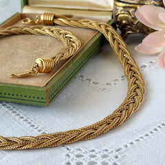 Vintage Napier 1995 Legacy Collection gold‑plated braided foxtail chain necklace with signed oval hangtag and lobster clasp.