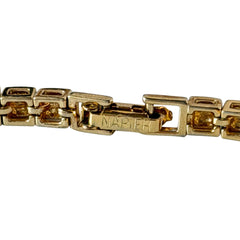 Vintage Napier gold‑tone cube link bracelet with articulated square links and signed fold‑over clasp.