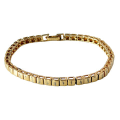 Vintage Napier gold‑tone cube link bracelet with articulated square links and signed fold‑over clasp.