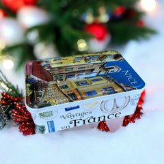 French holiday tin gift box with two mini Marseille soaps and a lavender sachet nestled in crinkle paper, available in Paris, Nice, or Côte d’Azur designs — a festive surprise gift from France.