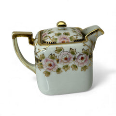 Antique Nippon Morimura Brothers square porcelain creamer with lid, hand-painted pink roses, gold moriage accents, and faded green maker’s mark on base.