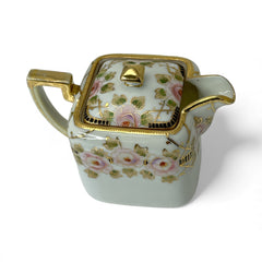 Antique Nippon Morimura Brothers square porcelain creamer with lid, hand-painted pink roses, gold moriage accents, and faded green maker’s mark on base.