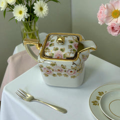 Antique Nippon Morimura Brothers square porcelain creamer with lid, hand-painted pink roses, gold moriage accents, and faded green maker’s mark on base.