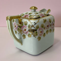 Antique Nippon Morimura Brothers square porcelain creamer with lid, hand-painted pink roses, gold moriage accents, and faded green maker’s mark on base.