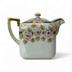 Antique Nippon Morimura Brothers square porcelain creamer with lid, hand-painted pink roses, gold moriage accents, and faded green maker’s mark on base.