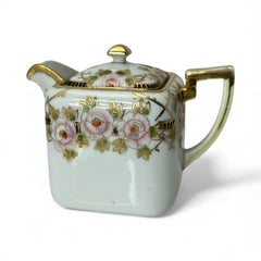 Antique Nippon Morimura Brothers square porcelain creamer with lid, hand-painted pink roses, gold moriage accents, and faded green maker’s mark on base.