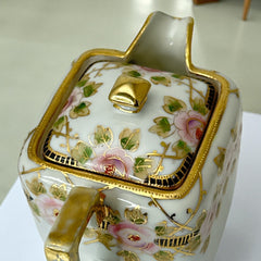 Antique Nippon Morimura Brothers square porcelain creamer with lid, hand-painted pink roses, gold moriage accents, and faded green maker’s mark on base.
