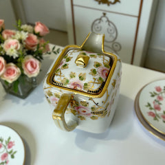 Antique Nippon Morimura Brothers square porcelain creamer with lid, hand-painted pink roses, gold moriage accents, and faded green maker’s mark on base.