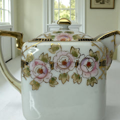 Antique Nippon Morimura Brothers square porcelain creamer with lid, hand-painted pink roses, gold moriage accents, and faded green maker’s mark on base.