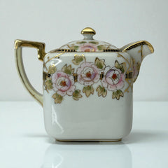 Antique Nippon Morimura Brothers square porcelain creamer with lid, hand-painted pink roses, gold moriage accents, and faded green maker’s mark on base.
