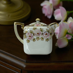 Antique Nippon Morimura Brothers square porcelain creamer with lid, hand-painted pink roses, gold moriage accents, and faded green maker’s mark on base.