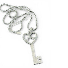 Vintage Nolan Miller silver-tone key pendant necklace with clear rhinestones in heart and infinity design, shown on twisted rope chain.