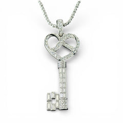 Vintage Nolan Miller silver-tone key pendant necklace with clear rhinestones in heart and infinity design, shown on twisted rope chain.