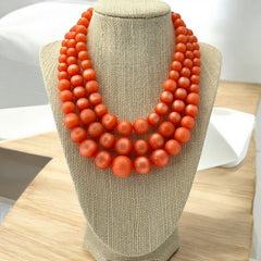 Vintage Orange Moonglow Lucite 3-Strand Necklace (1950s)
