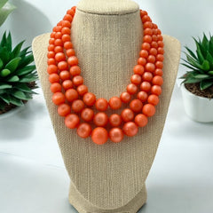 Vintage Orange Moonglow Lucite 3-Strand Necklace (1950s)