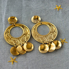 Vintage 1980s gold‑tone circle dangle post earrings with embossed paisley design and dangling discs, displayed on original Impressions card.