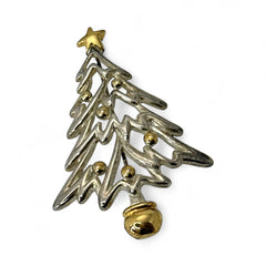 Vintage Paquette Christmas tree brooch in silver and gold-tone metal, featuring a modernist design with circular cutouts and a gold star at the top; signed on the back, circa 1990s, in very good condition.