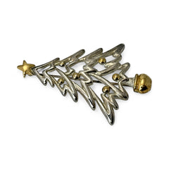 Vintage Paquette Christmas tree brooch in silver and gold-tone metal, featuring a modernist design with circular cutouts and a gold star at the top; signed on the back, circa 1990s, in very good condition.
