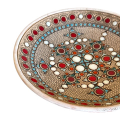 Vintage French studio pottery bowl by Paul Dordet, hand-formed in textured buff clay with red, white, and blue glazed circular motifs; signed on the underside and shown with hanging wire for optional wall display.