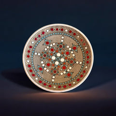 Vintage French studio pottery bowl by Paul Dordet, hand-formed in textured buff clay with red, white, and blue glazed circular motifs; signed on the underside and shown with hanging wire for optional wall display.