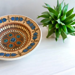 Rare vintage French studio pottery bowl by Paul Dordet, featuring textured buff and terracotta clay with blue and white glazed circles in an orientalist pattern; signed on the underside and suitable for display flat or wall-hung.