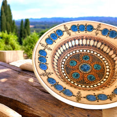 Rare vintage French studio pottery bowl by Paul Dordet, featuring textured buff and terracotta clay with blue and white glazed circles in an orientalist pattern; signed on the underside and suitable for display flat or wall-hung.