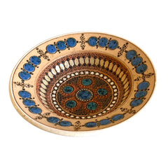 Rare vintage French studio pottery bowl by Paul Dordet, featuring textured buff and terracotta clay with blue and white glazed circles in an orientalist pattern; signed on the underside and suitable for display flat or wall-hung.