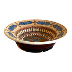 Rare vintage French studio pottery bowl by Paul Dordet, featuring textured buff and terracotta clay with blue and white glazed circles in an orientalist pattern; signed on the underside and suitable for display flat or wall-hung.