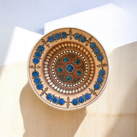 Rare vintage French studio pottery bowl by Paul Dordet, featuring textured buff and terracotta clay with blue and white glazed circles in an orientalist pattern; signed on the underside and suitable for display flat or wall-hung.