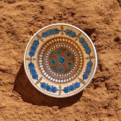 Rare vintage French studio pottery bowl by Paul Dordet, featuring textured buff and terracotta clay with blue and white glazed circles in an orientalist pattern; signed on the underside and suitable for display flat or wall-hung.