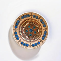 Rare vintage French studio pottery bowl by Paul Dordet, featuring textured buff and terracotta clay with blue and white glazed circles in an orientalist pattern; signed on the underside and suitable for display flat or wall-hung.