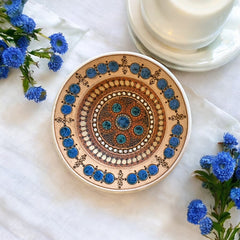Rare vintage French studio pottery bowl by Paul Dordet, featuring textured buff and terracotta clay with blue and white glazed circles in an orientalist pattern; signed on the underside and suitable for display flat or wall-hung.