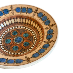 Rare vintage French studio pottery bowl by Paul Dordet, featuring textured buff and terracotta clay with blue and white glazed circles in an orientalist pattern; signed on the underside and suitable for display flat or wall-hung.