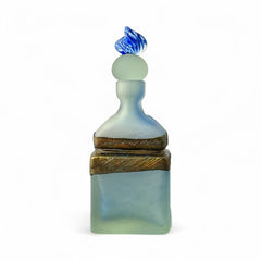 Vintage Romanian art glass perfume bottle from the 1990s, featuring frosted blue and green glass with a sculptural swirled stopper and bronze wire bow detail around the neck. Square base with a tapered neck; dauber slightly shortened due to breakage.