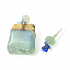Vintage Romanian art glass perfume bottle from the 1990s, featuring frosted blue and green glass with a sculptural swirled stopper and bronze wire bow detail around the neck. Square base with a tapered neck; dauber slightly shortened due to breakage.