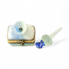 Vintage Romanian art glass perfume bottle from the 1990s, featuring frosted blue and green glass with a sculptural swirled stopper and bronze wire bow detail around the neck. Square base with a tapered neck; dauber slightly shortened due to breakage.
