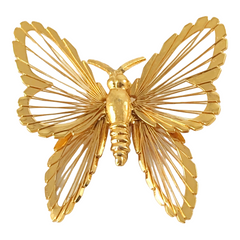 Vintage Monet gold‑tone butterfly brooch with openwork wire wings