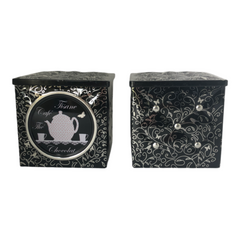 French black matelassé metal tea cube tin with silver accents and a pink teapot motif by Moldeo