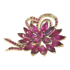 Vintage Weiss fuchsia rhinestone floral brooch and matching clip‑on earrings in light gold tone with layered petal design.