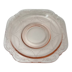 Vintage pink depression glass set featuring 2 delicate cups from the American Sweetheart collection and 2 square saucers from the Madrid collection, both adorned with intricate floral and geometric etched patterns. A timeless and sustainable addition to any table or décor.