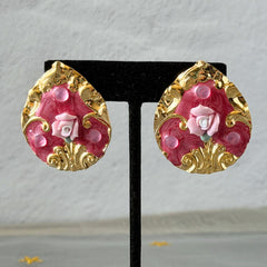 Vintage 1980s teardrop post earrings with 3D pink polymer clay rose, pink enamel base, and gold tone pressed metal scrollwork on original card.