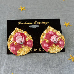 Vintage 1980s teardrop post earrings with 3D pink polymer clay rose, pink enamel base, and gold tone pressed metal scrollwork on original card.