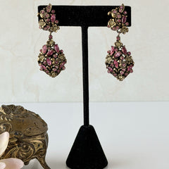 Vintage Hollycraft pink and yellow rhinestone gold‑tone floral dangle screw‑back earrings shown from different angles.