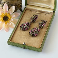 Vintage Hollycraft pink and yellow rhinestone gold‑tone floral dangle screw‑back earrings shown from different angles.