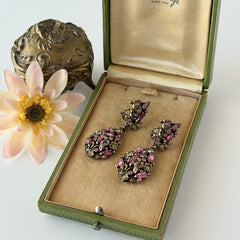 Vintage Hollycraft pink and yellow rhinestone gold‑tone floral dangle screw‑back earrings shown from different angles.