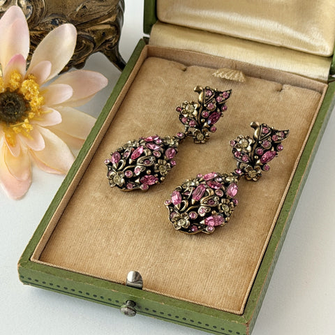 Vintage Hollycraft pink and yellow rhinestone gold‑tone floral dangle screw‑back earrings shown from different angles.