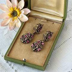 Vintage Hollycraft pink and yellow rhinestone gold‑tone floral dangle screw‑back earrings shown from different angles.