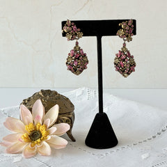 Vintage Hollycraft pink and yellow rhinestone gold‑tone floral dangle screw‑back earrings shown from different angles.