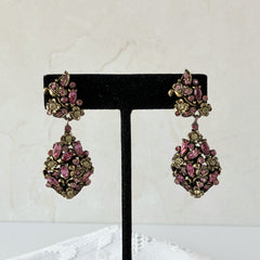 Vintage Hollycraft pink and yellow rhinestone gold‑tone floral dangle screw‑back earrings shown from different angles.